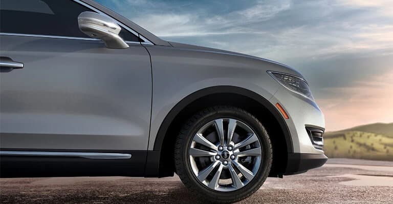 Lincoln SUV parked on the road, representing roadside assistance and peace of mind.