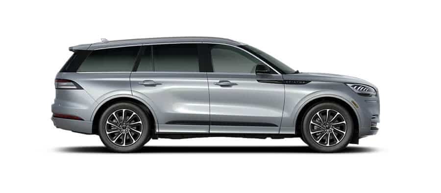 Silver SUV side view, featuring modern design and sleek alloy wheels.