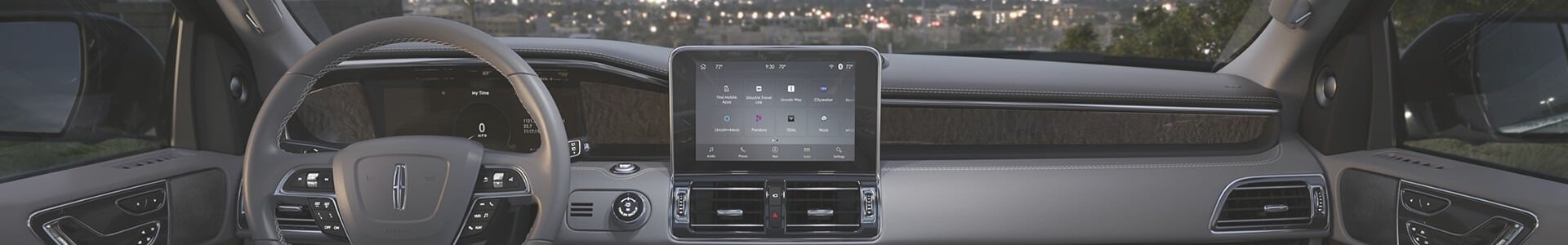 Luxury car interior with a digital dashboard and touchscreen display, showcasing modern design elements.