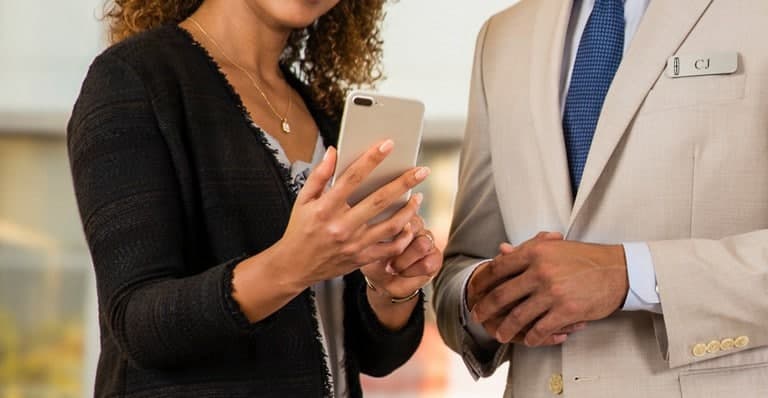 Customer receiving service updates on a smartphone.