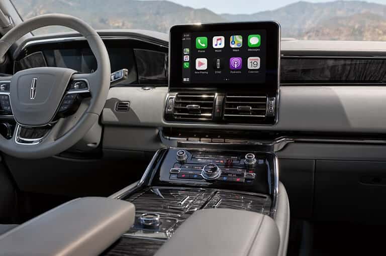 Lincoln dashboard with SYNC® 4 display showing Apple CarPlay